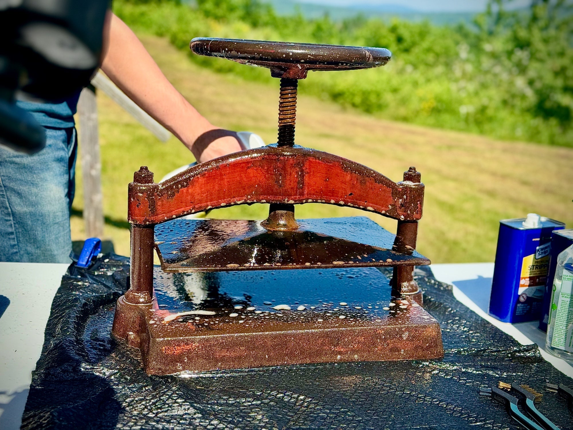 Book press being cleaned of rust