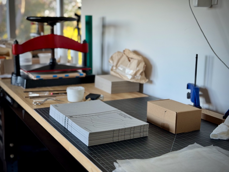 Case wraps stacked in front of book press